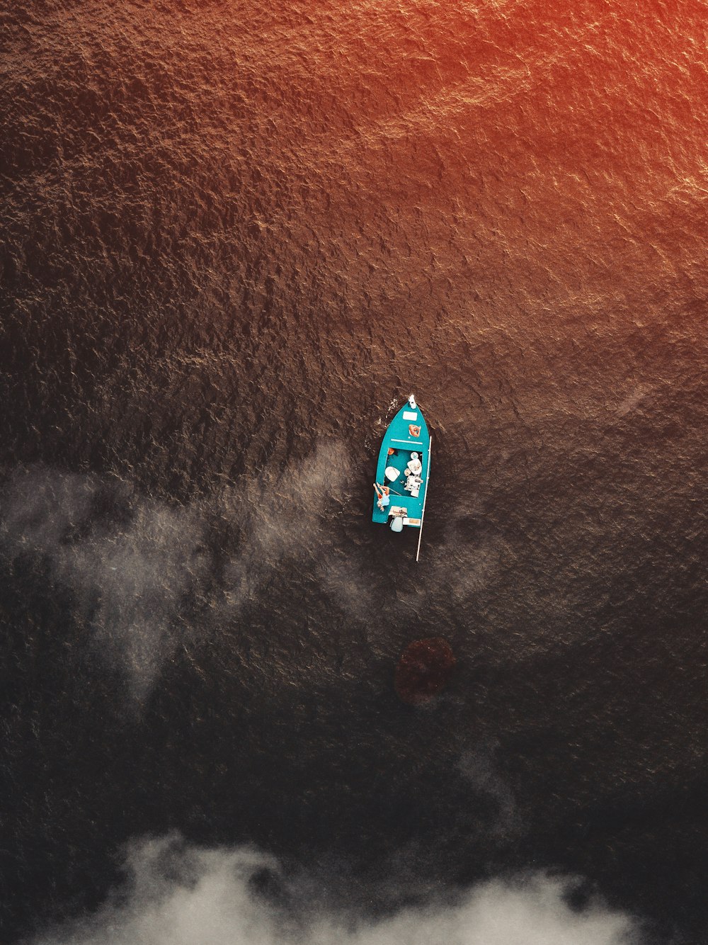 aerial view of green boat on sea at daytime