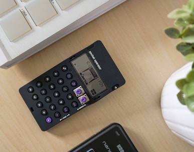 black digital device on table