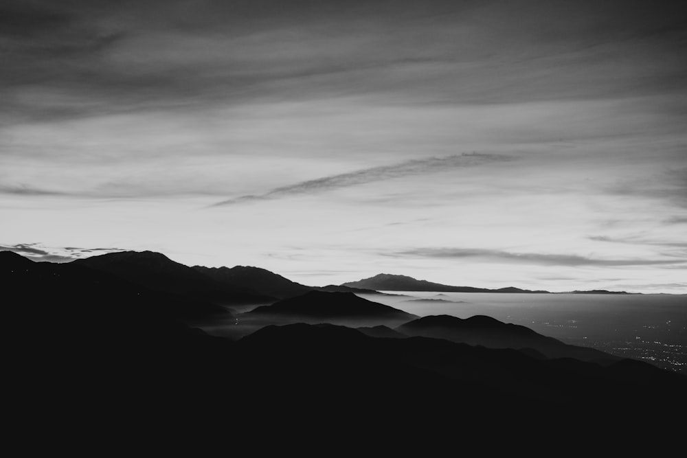 mountain range under nimbus clouds