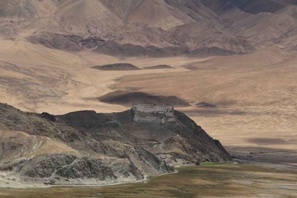 gray mountain near body of water