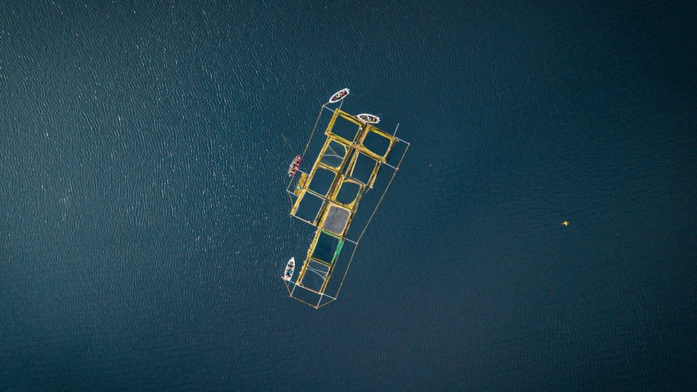 an aerial view of a boat in the water