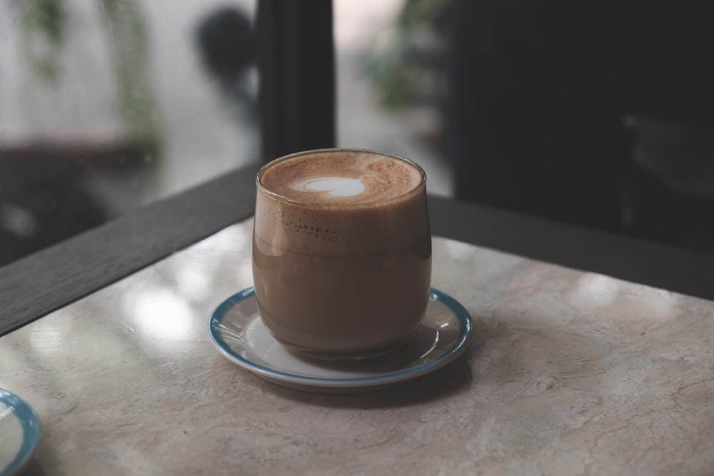 coffee glass on white saucer