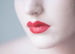 woman with orange lipsticks