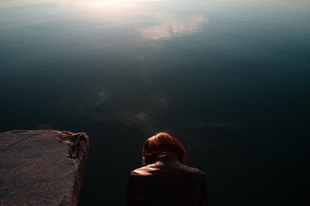 person looking on body of water