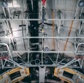 photo of white pipes on the ceiling