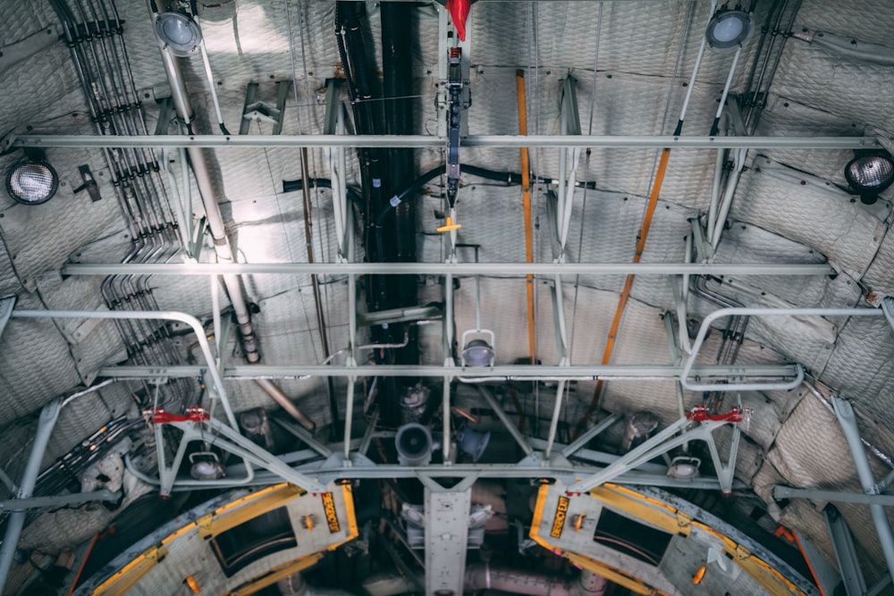 photo of white pipes on the ceiling