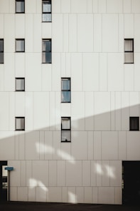 photo of white concrete building during daytime