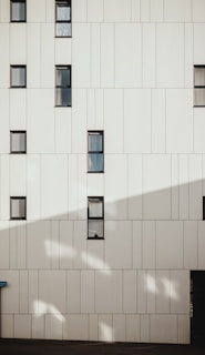 photo of white concrete building during daytime