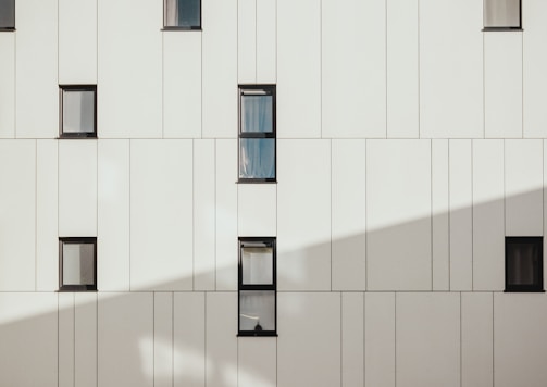 photo of white concrete building during daytime