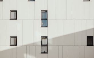 photo of white concrete building during daytime