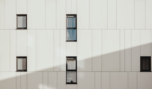 photo of white concrete building during daytime
