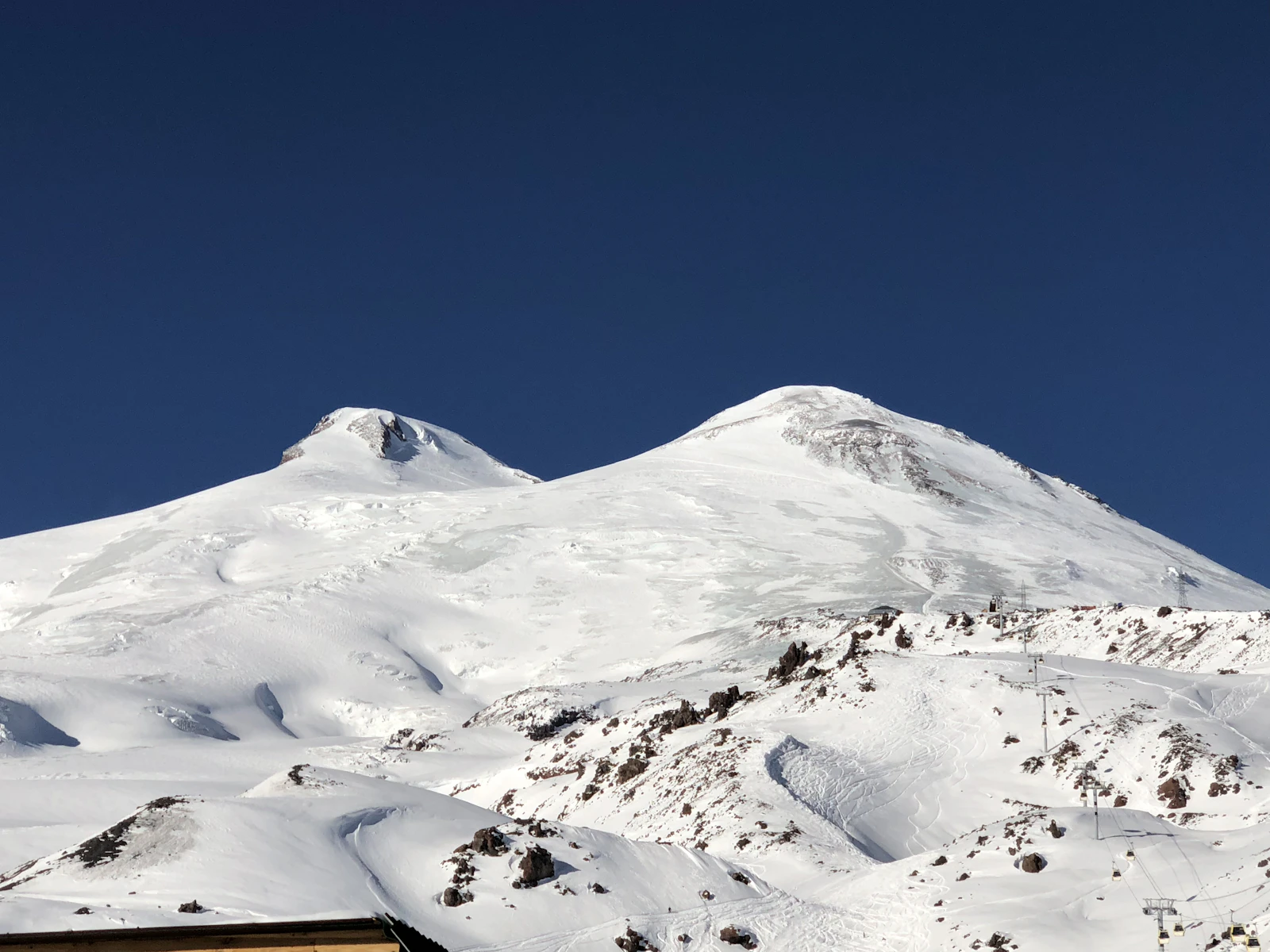 The two snow summits of Elbrus under a dark blue sky — Mount Elbrus, Russia
