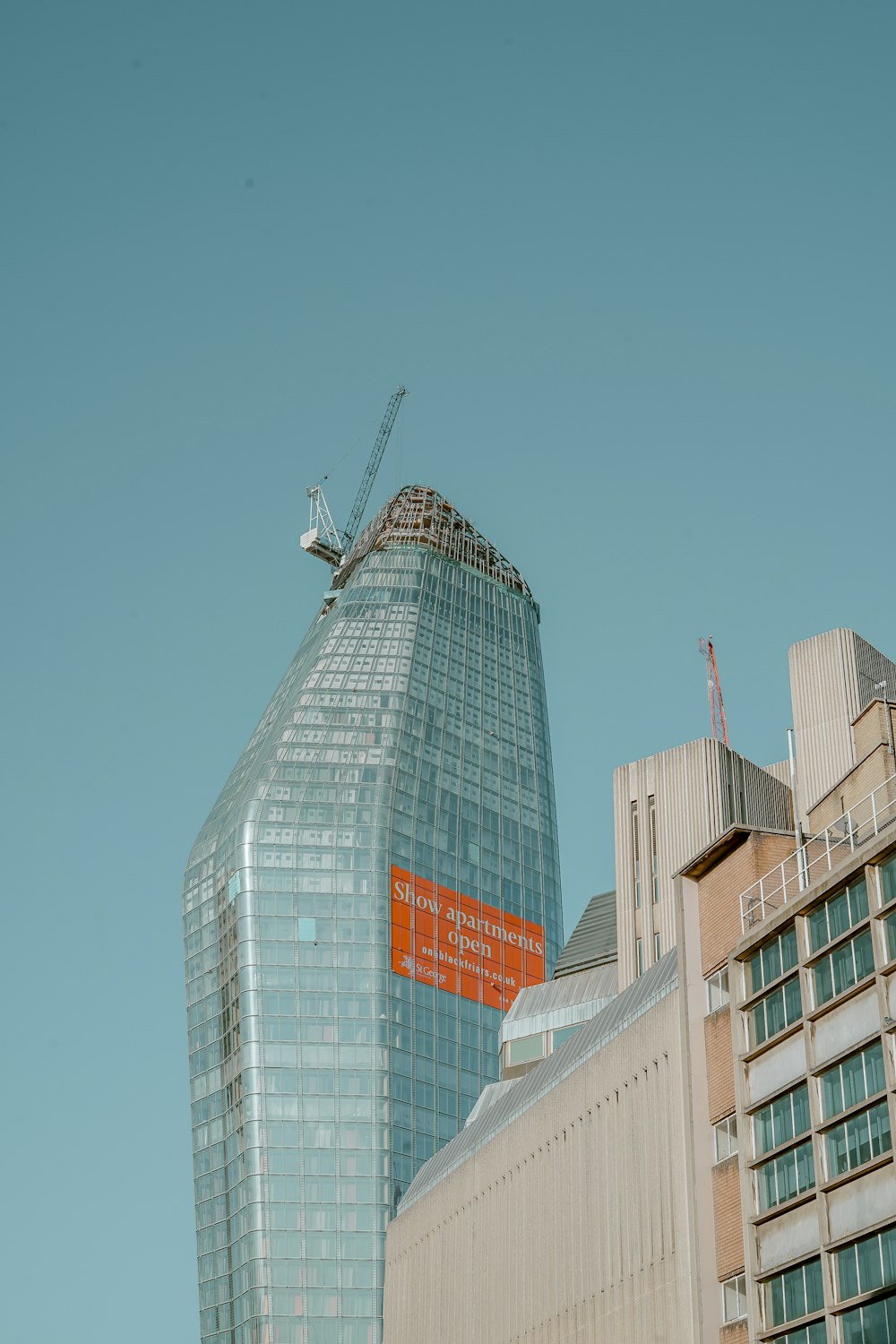 high-rise building under blue sky