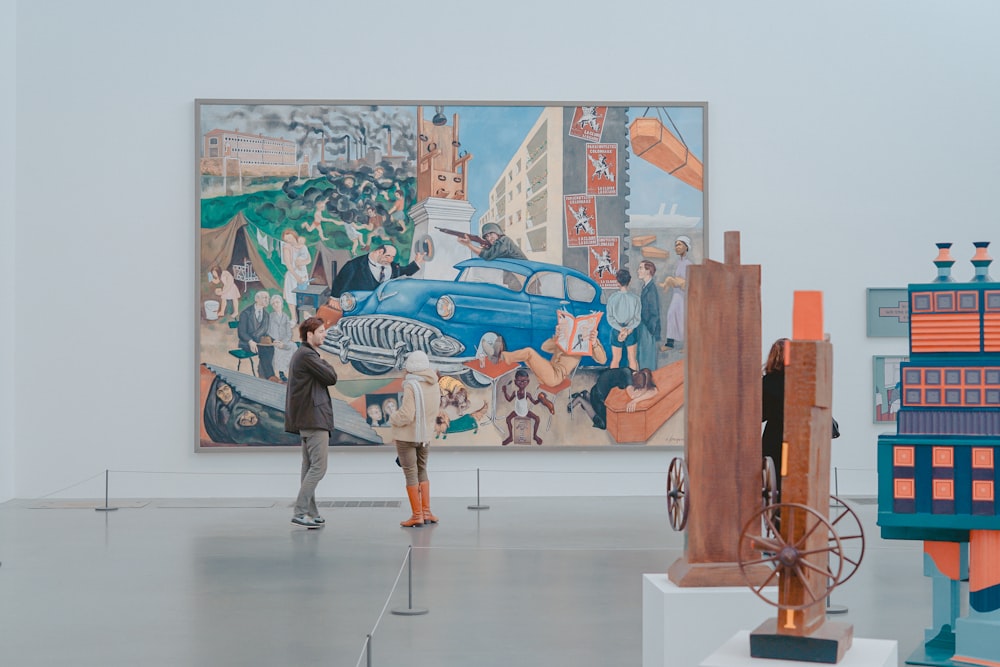 man and woman standing in front of painting in gallery