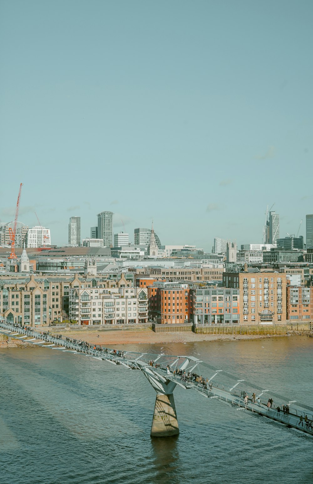 gray metal bridge near buildings during daytime