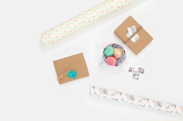 flat lay photography of wallpaper and box