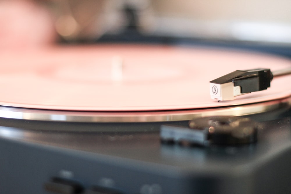 selective focus photography of black turntable