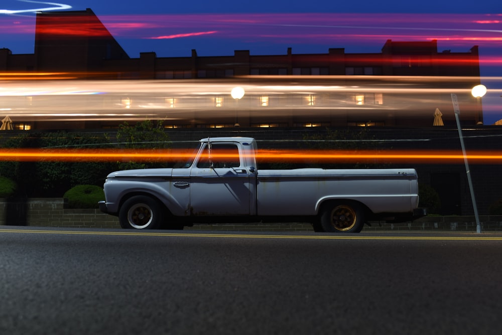 timelapse photo of white single cab truck