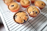 selective focus photography of cupcakes on top of white table