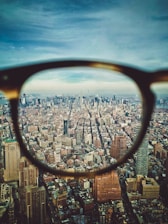 city buildings on eyeglasses view