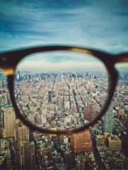 city buildings on eyeglasses view