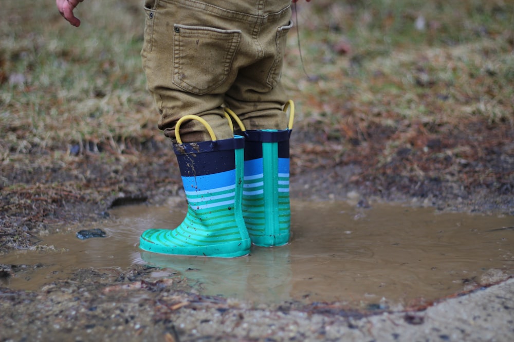 person stepping on body of water