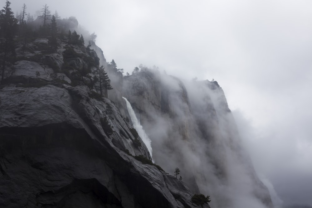 grayscale photo of waterfalls