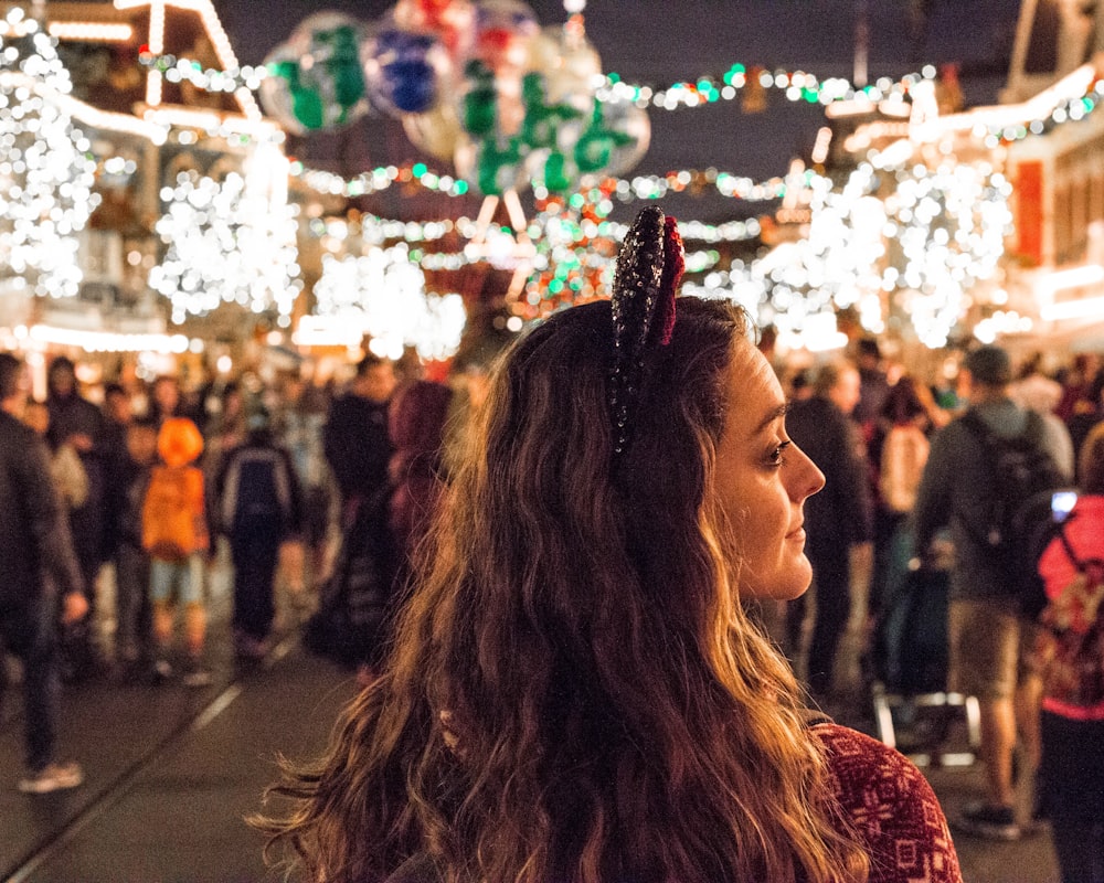 woman standing near people photography