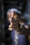 person holding cigarette stick on left hand