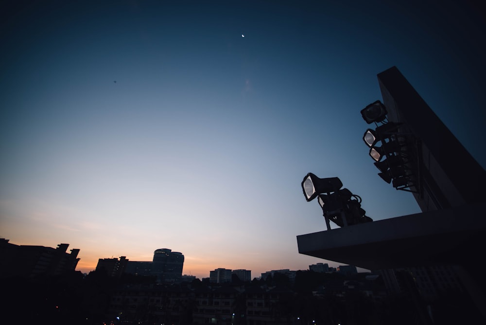 silhouette photo of spot lights