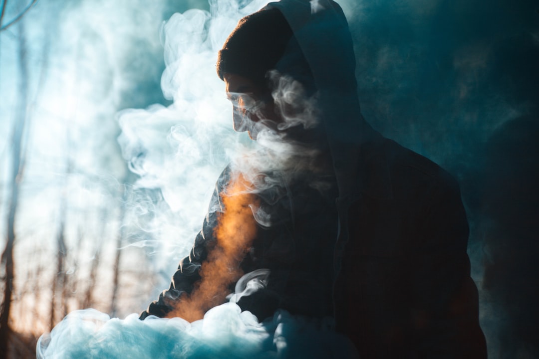 person with smoke silhouette, the smoke
