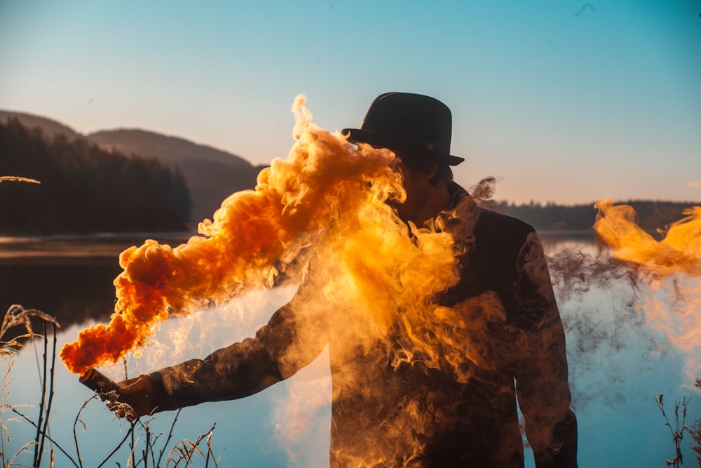 man holding flare