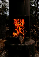 Engineers assembling a prototype stove in a bright workshop.