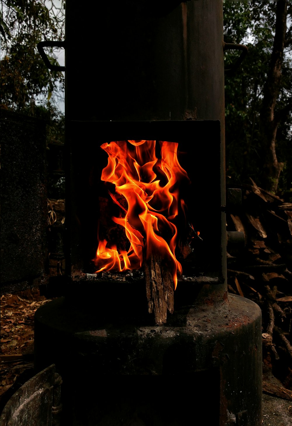 fire burning inside container outdoor