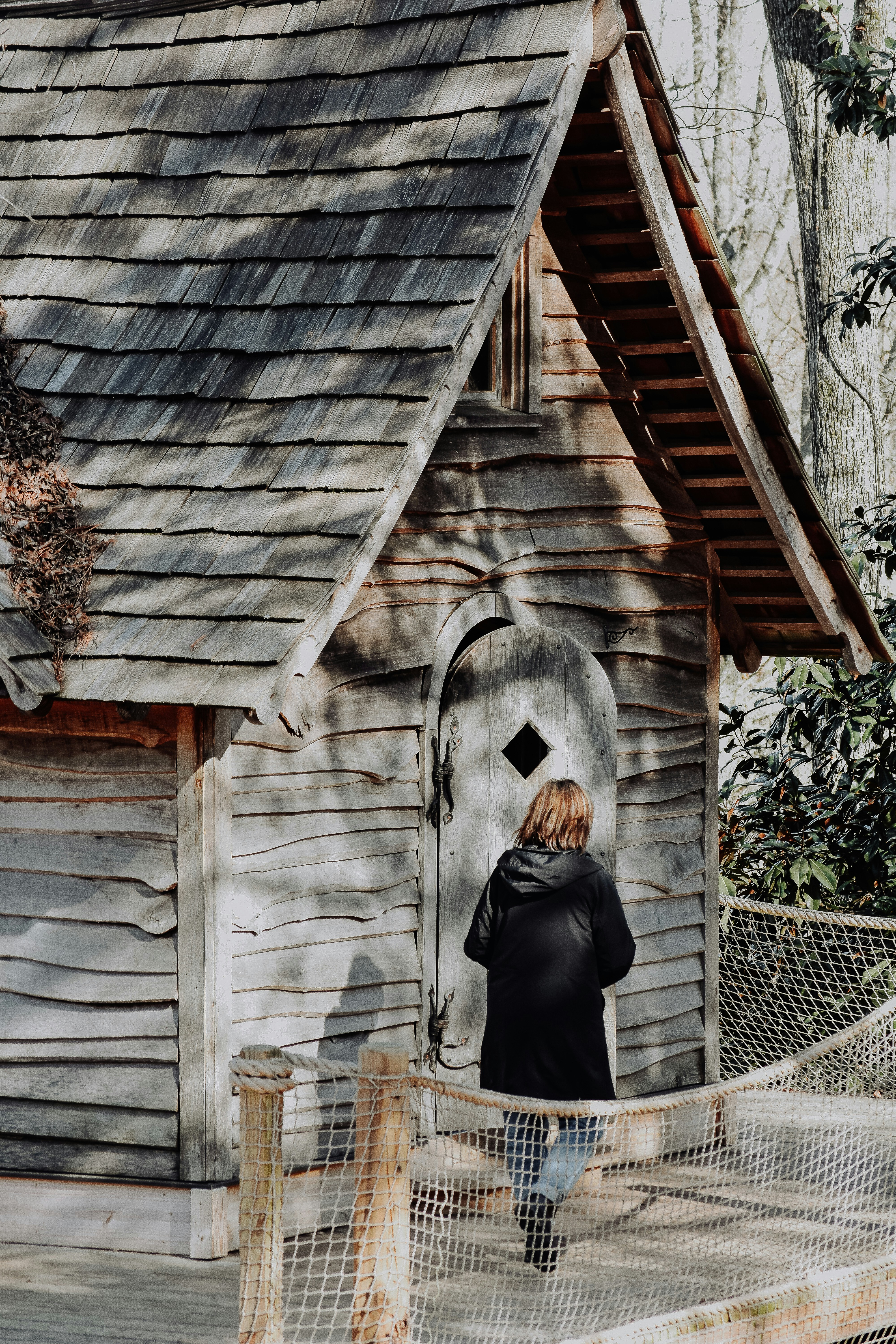 woman standing outside house