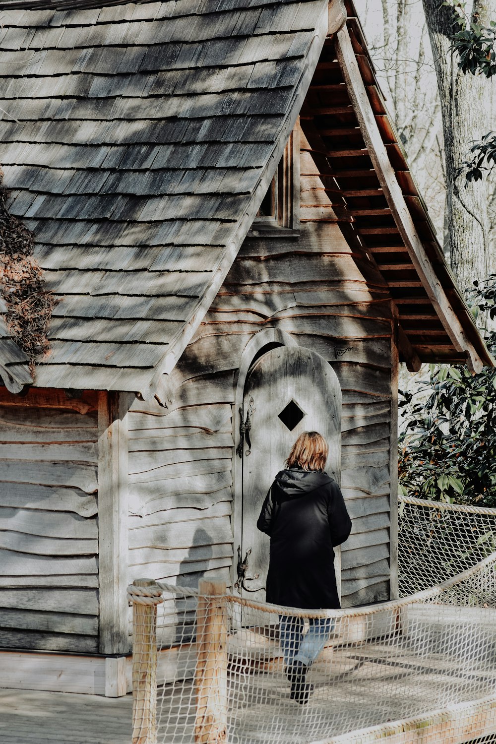 woman standing outside house