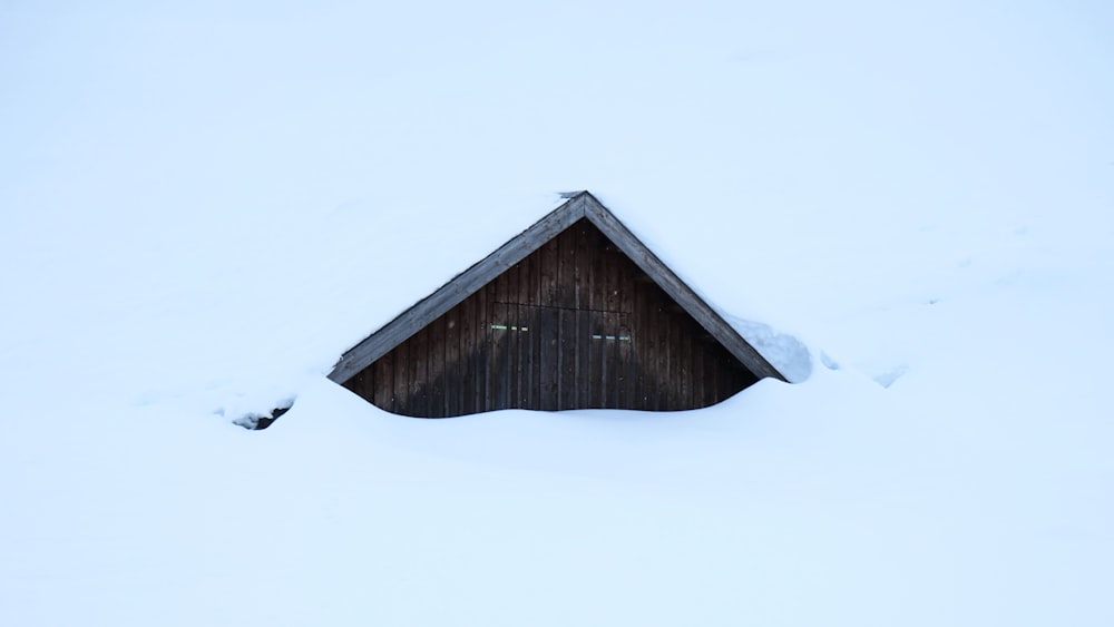 wooden house covering white snow