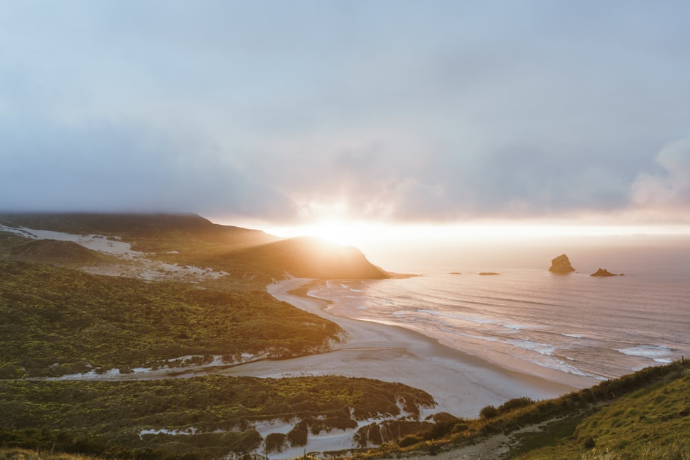 landscape photo of mountain and ocean