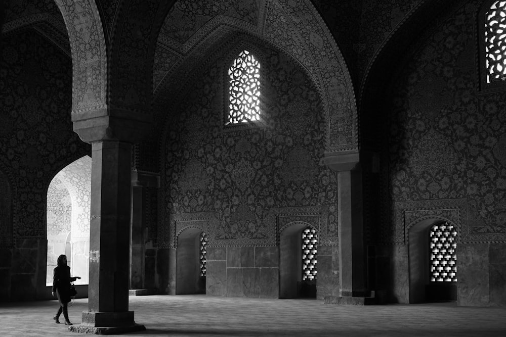 grayscale photography of woman inside dome