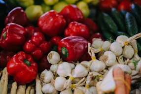 red bell pepper on white garlics
