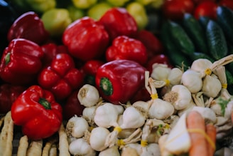red bell pepper on white garlics