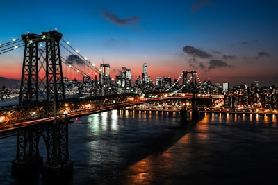 lighted cable bridge near high-rise buildings new york google meet background