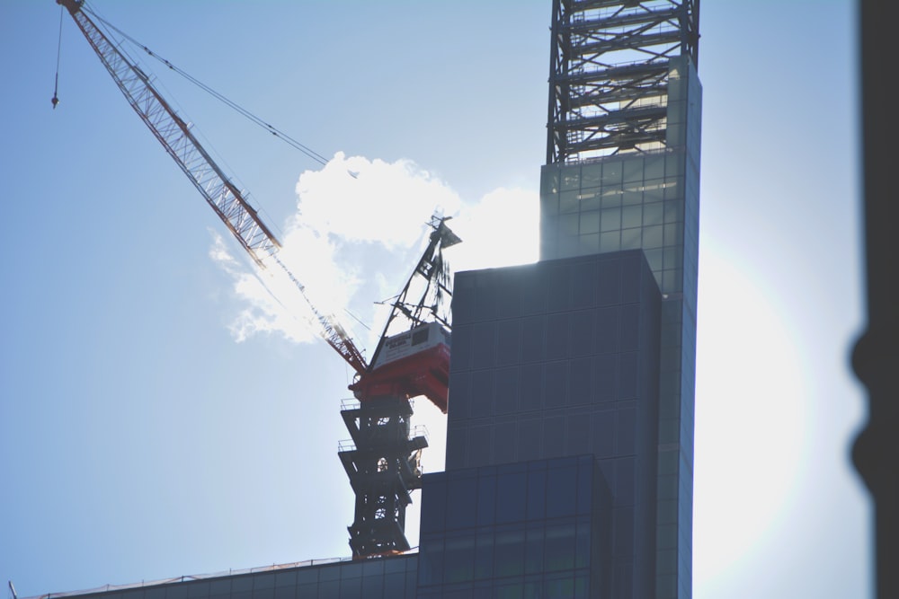 red crane on top of building