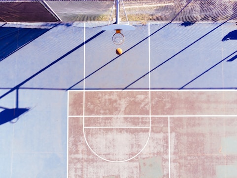 A basketball court with player statistics overlay.