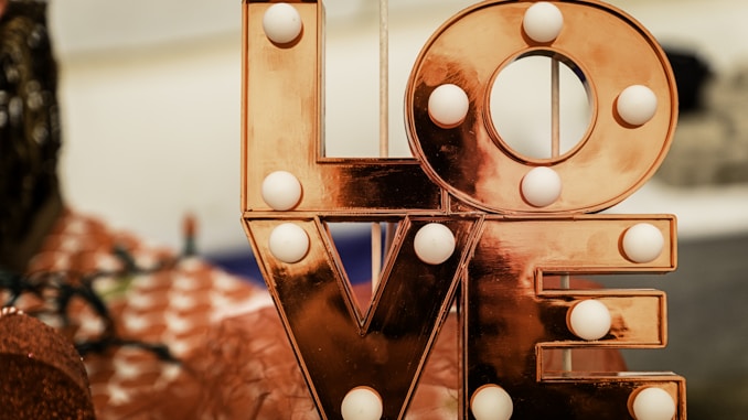 brown and white love lighted signage