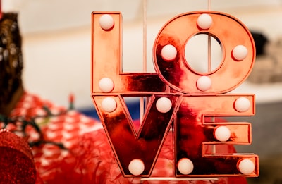 brown and white love lighted signage valentine's day google meet background