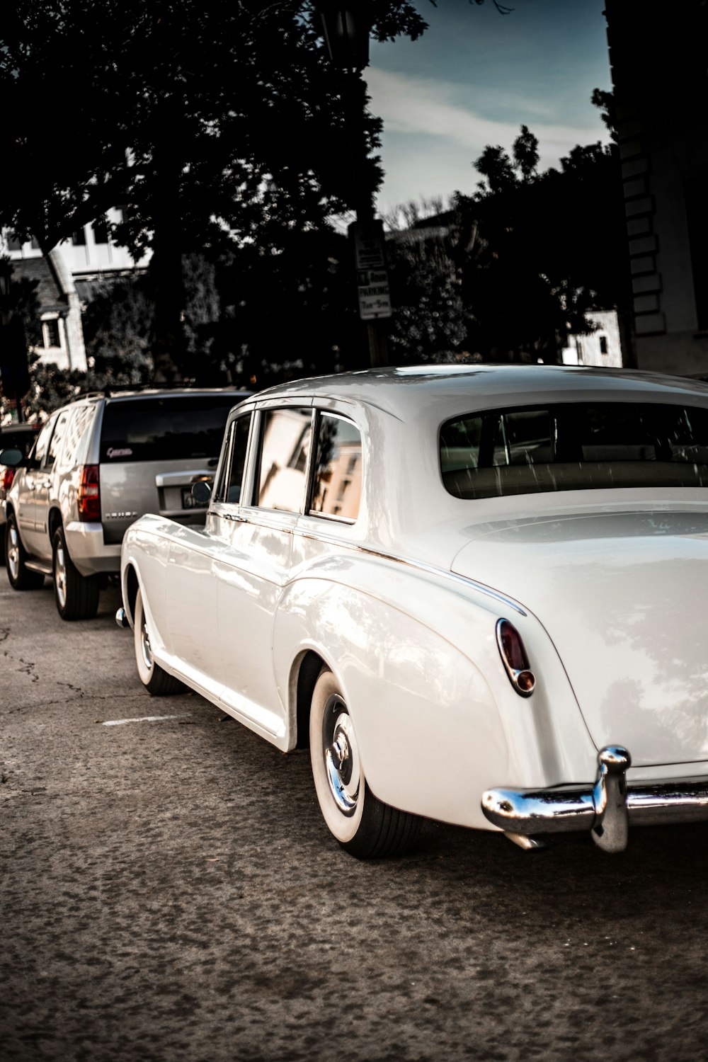 photo of white classic sedan