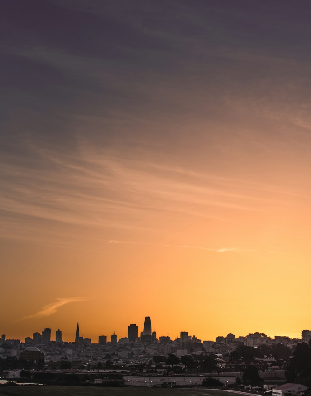 silhouette of city during sunset