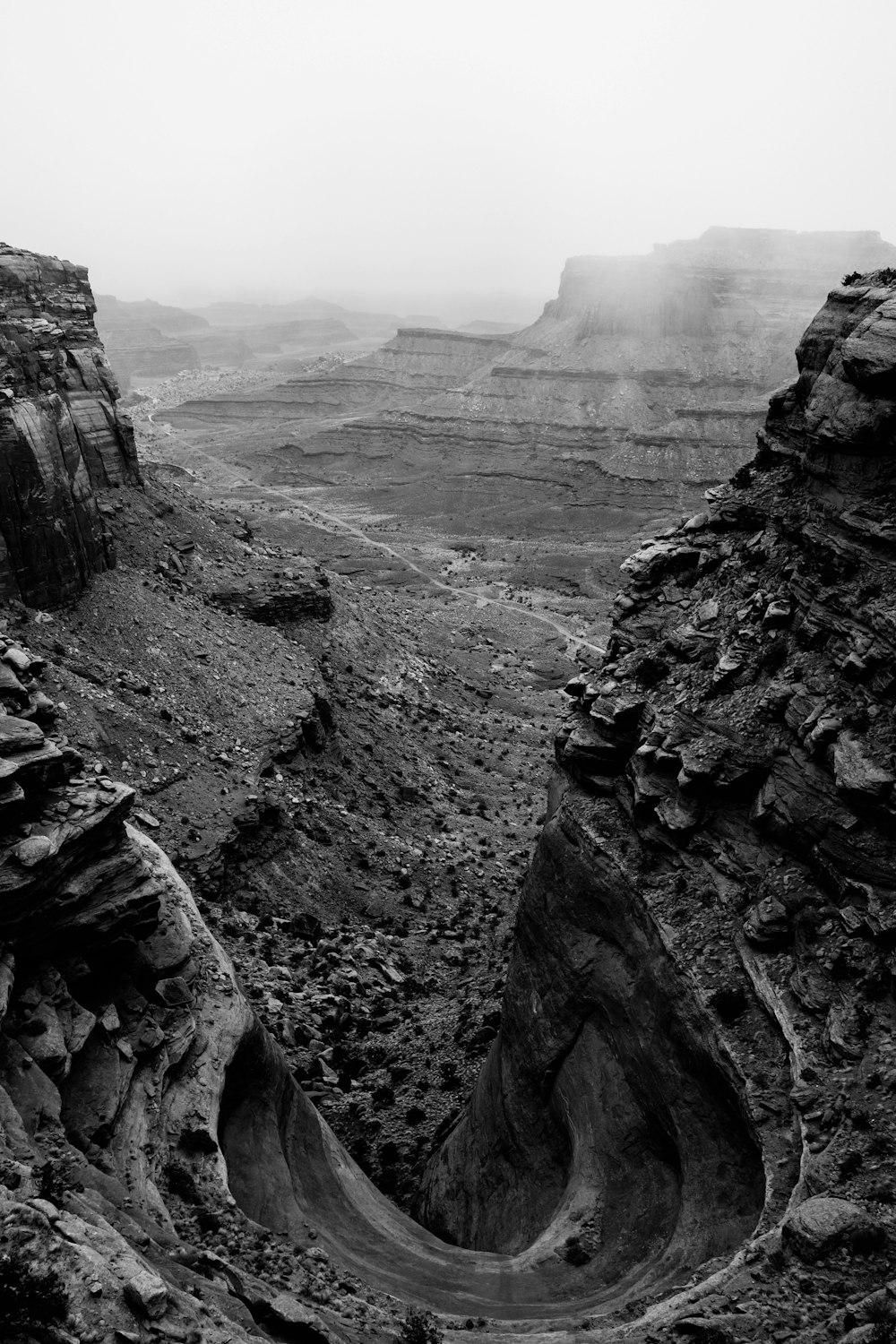 grayscale photography of rock mountain