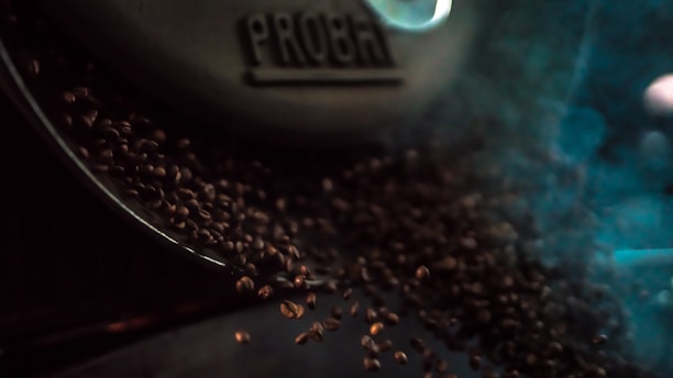 Coffee beans being roasted in a modern small-batch roaster.